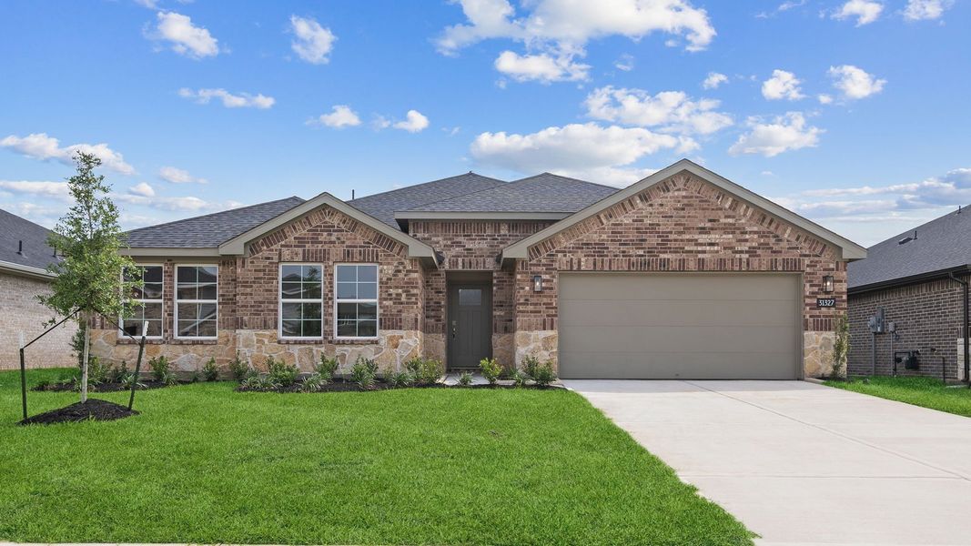 Front exterior of a new home in Tamarron, Fulshear, TX, highlighting curb appeal (Image 1). Front exterior of a new home in Tamarron, Fulshear, TX, highlighting curb appeal (Image 1).
