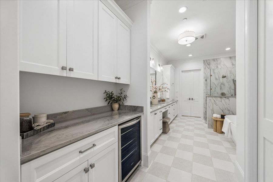 Stunning primary bath with coffee bar area.