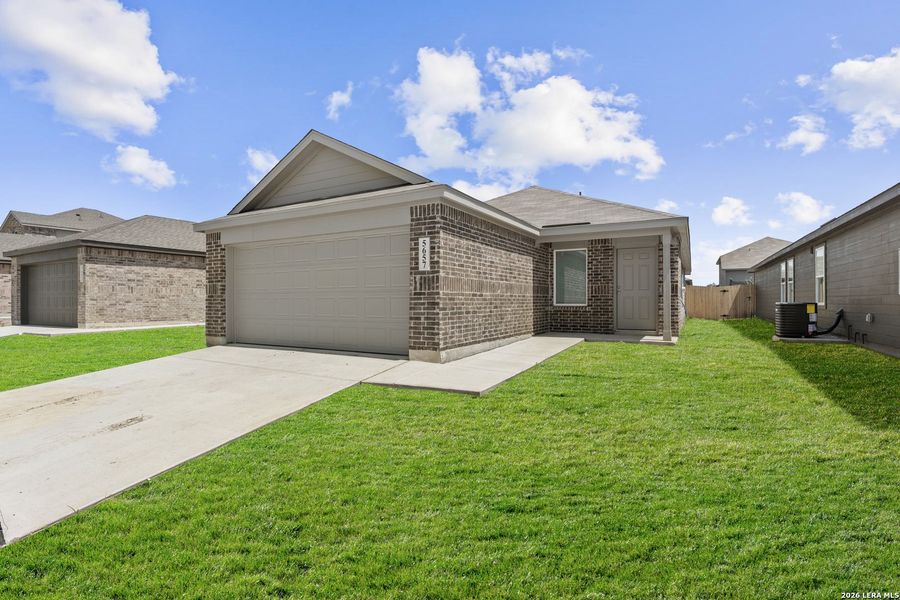 Front exterior of a new home in Higdon Crossing, San Antonio, TX, highlighting curb appeal (Image 1). Front exterior of a new home in Higdon Crossing, San Antonio, TX, highlighting curb appeal (Image 1).