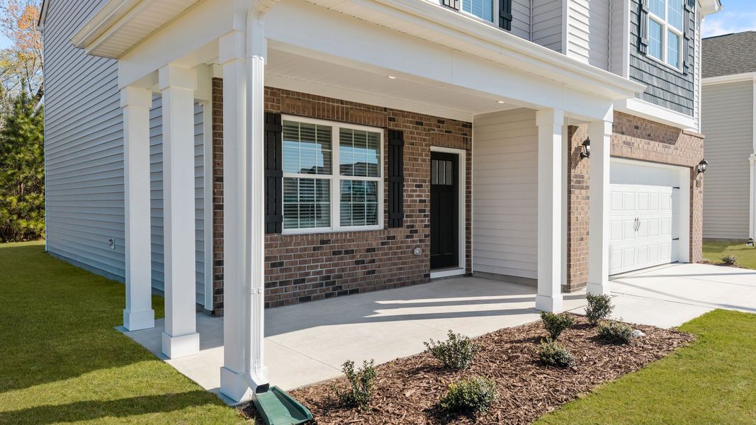 Exterior details and patio area of a home in Ridgewood Farms, Winterville (Image 4).