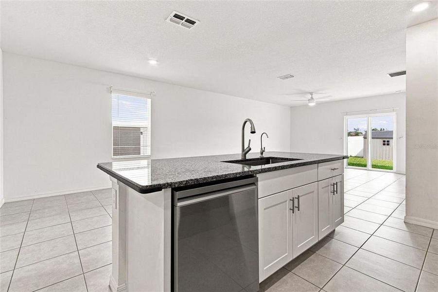 Furnished interior view inside a new home in The Isle of Avalon, Spring Hill (Image 12).