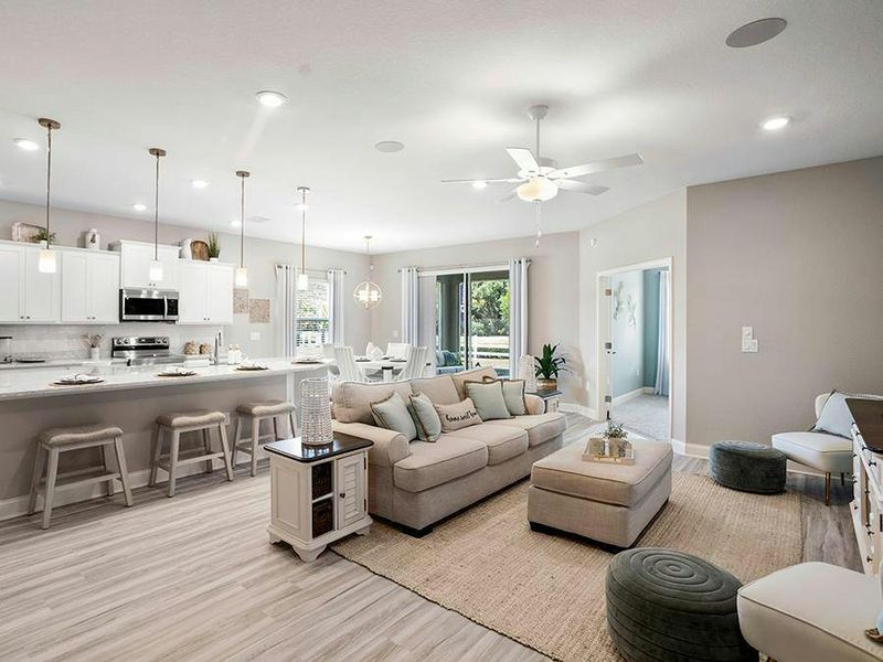 This home includes a sunny and spacious open-concept living area - Shelby II by Highland Homes