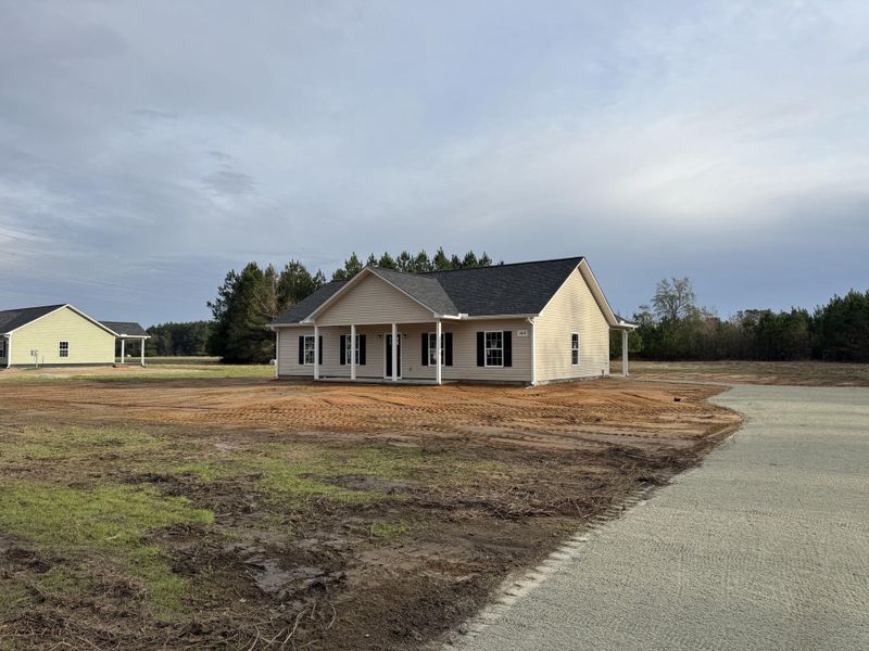 Front exterior of a new home in , St. George, SC, highlighting curb appeal (Image 17). Front exterior of a new home in , St. George, SC, highlighting curb appeal (Image 17).