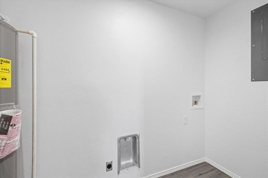 Clothes washing area featuring hookup for a washing machine, electric dryer hookup, dark hardwood / wood-style floors, and electric panel