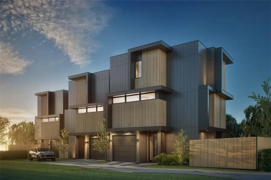 Modern home with driveway and an attached garage Modern home with driveway and an attached garage