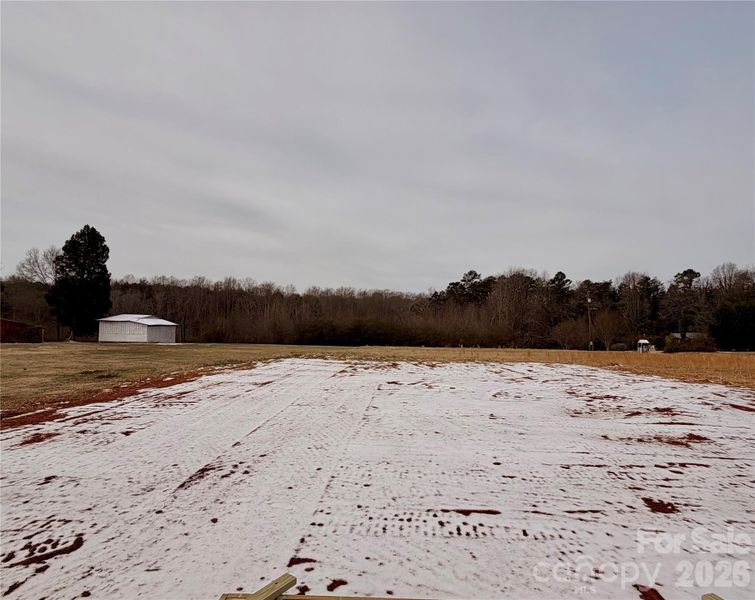 Large open yard. Deck is in the process of being built. Professional photos coming soon
