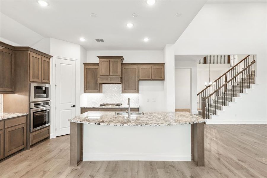 Furnished interior view inside a new home in Stone River Glen 60s, Royse City (Image 9).