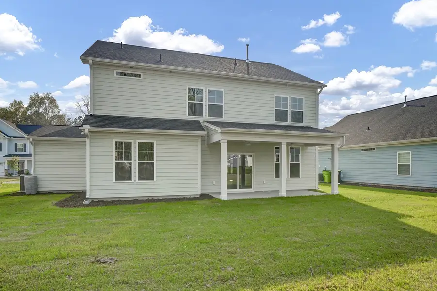 Exterior details and patio area of a home in Indigo at Abbey Preserve, Wilmington (Image 19).