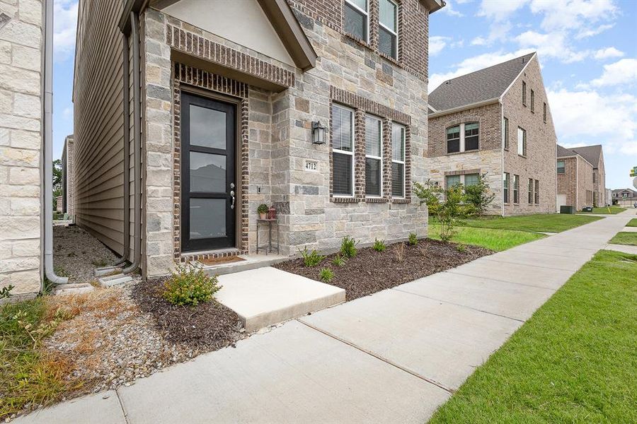 Front exterior of a new home in , Dallas, TX, highlighting curb appeal (Image 1). Front exterior of a new home in , Dallas, TX, highlighting curb appeal (Image 1).