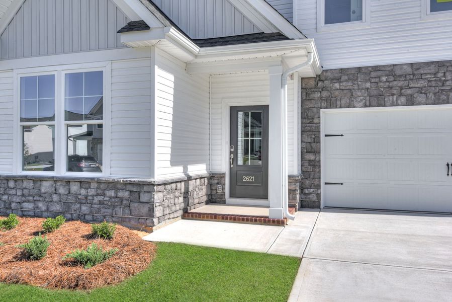 Exterior details and patio area of a home in Madison at Buice Lake, Acworth (Image 40).