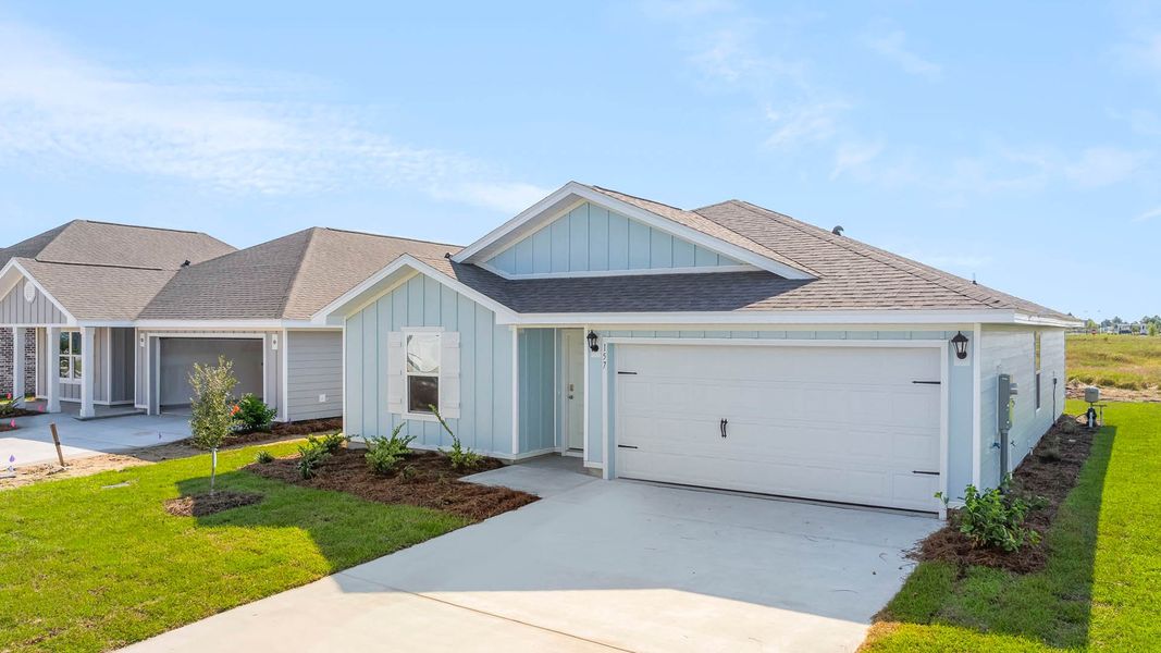 Front exterior of a new home in Owl's Head Farms, Freeport, FL, highlighting curb appeal (Image 18). Front exterior of a new home in Owl's Head Farms, Freeport, FL, highlighting curb appeal (Image 18).