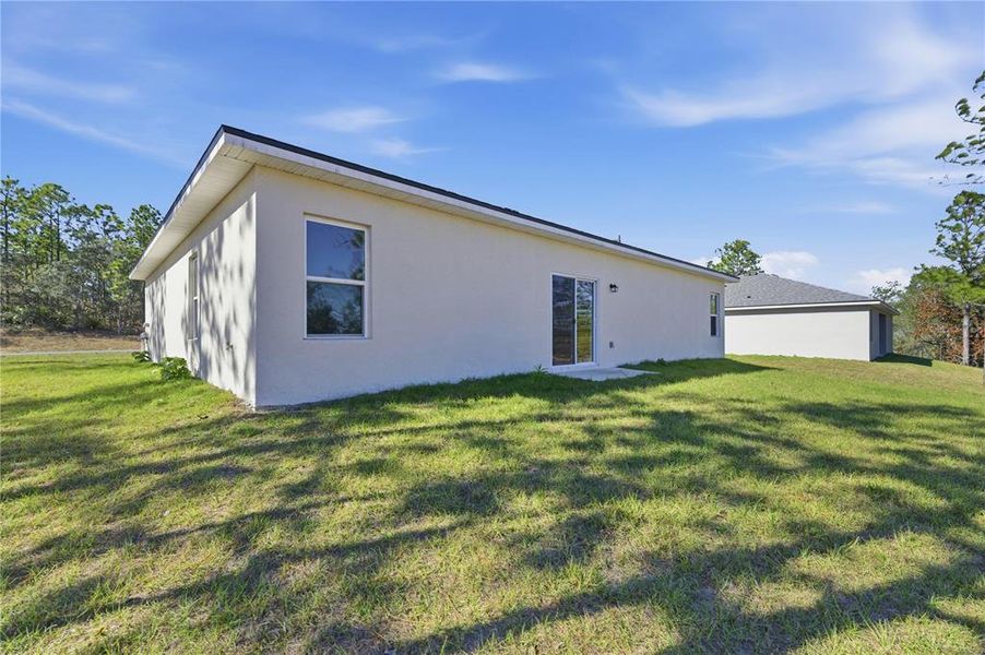Exterior details and patio area of a home in , Citrus Springs (Image 16).