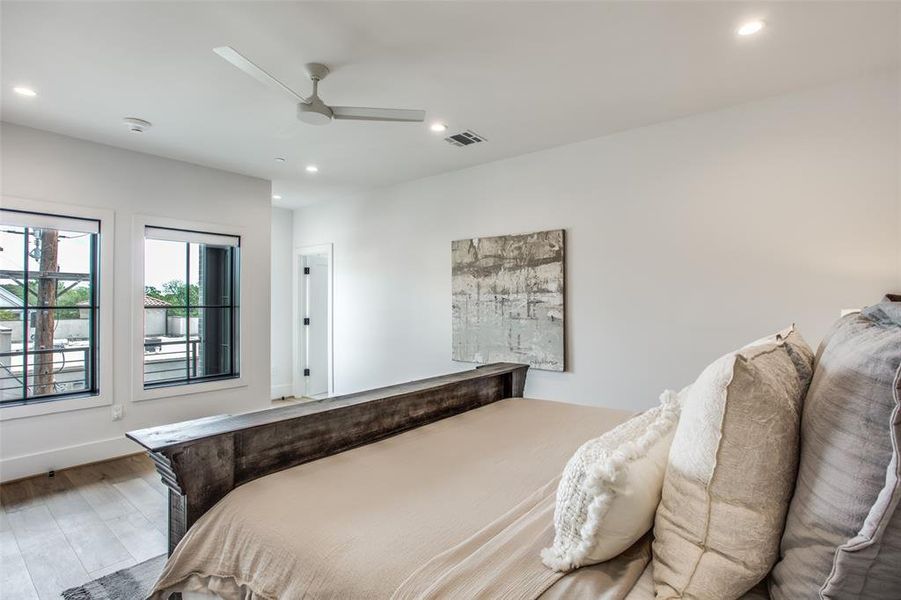 Bedroom featuring hardwood floors and ceiling fan