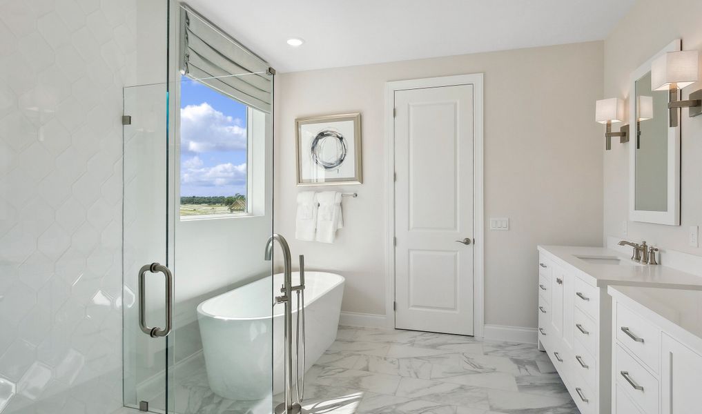 Lavish primary bath with freestanding tub