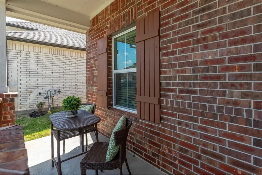 Exterior details and patio area of a home in Sunterra, Katy (Image 3).