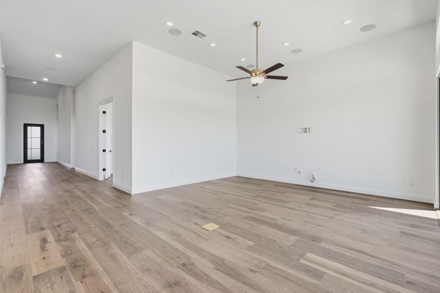 Spare room with recessed lighting, light wood finished floors, and a ceiling fan
