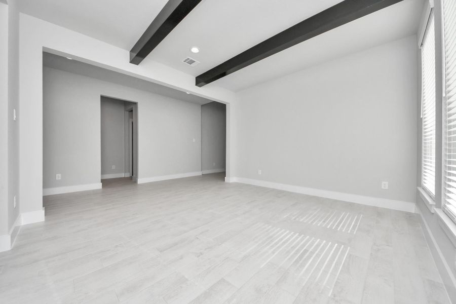 Make memories gathered around the table with your family and friends! This spacious dining room features elegant flooring, custom paint, and adjacent to family room and kitchen for open concept feel.