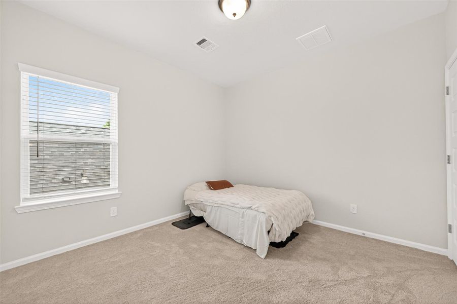 Furnished interior view inside a new home in Mill Creek Trails, Magnolia (Image 37).