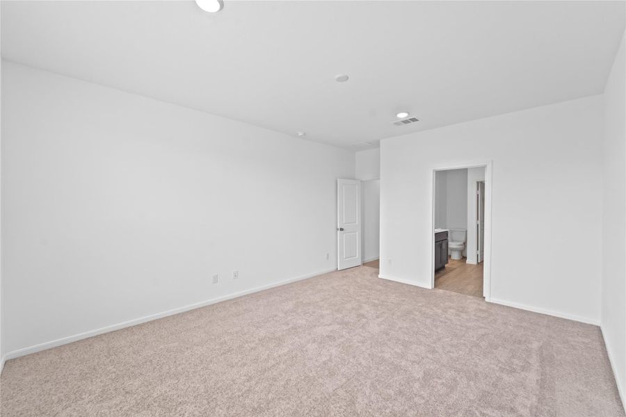 another view of primary bedroom