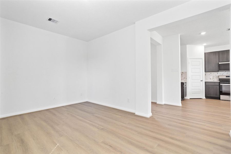 From this angle, the Den showcases its inviting openness through the wide entryway.