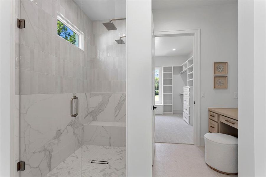 Primary bathroom with high end fixtures and stone selections.