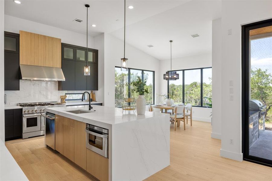 Culinary excellence meets effortless entertaining in this modern kitchen with ample counter space and scenic dining views.