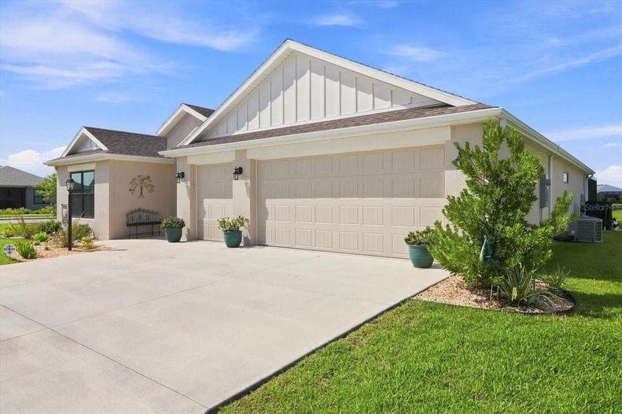 Front exterior of a new home in , The Villages, FL, highlighting curb appeal (Image 2).