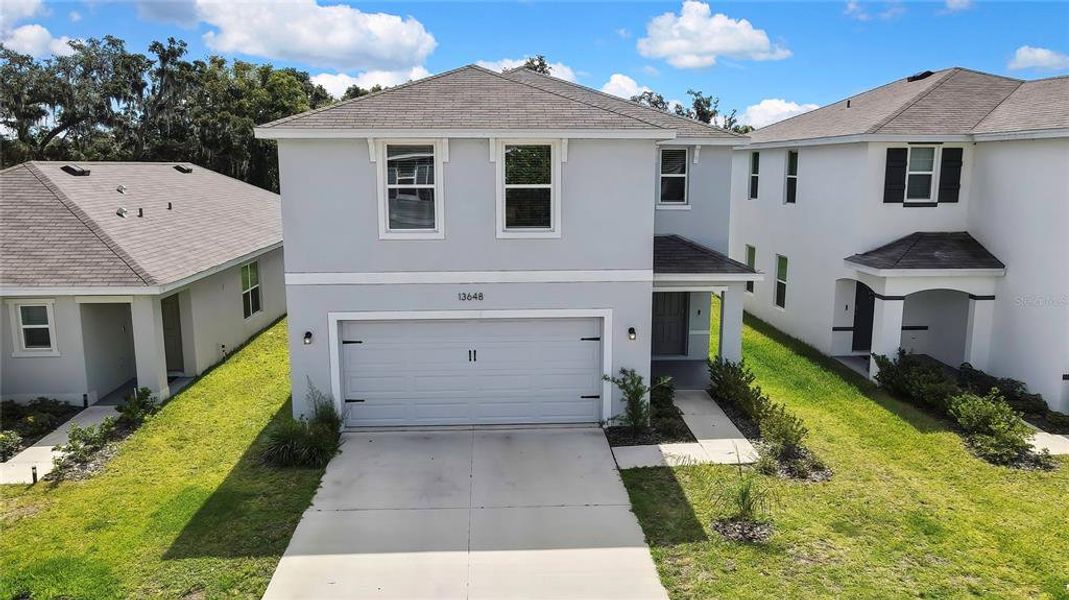 Front exterior of a new home in Heritage Hills, Dade City, FL, highlighting curb appeal (Image 21). Front exterior of a new home in Heritage Hills, Dade City, FL, highlighting curb appeal (Image 21).