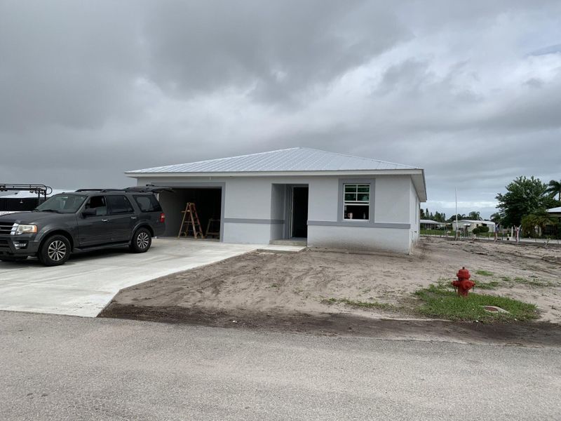 Front exterior of a new home in , Fort Pierce, FL, highlighting curb appeal (Image 1). Front exterior of a new home in , Fort Pierce, FL, highlighting curb appeal (Image 1).