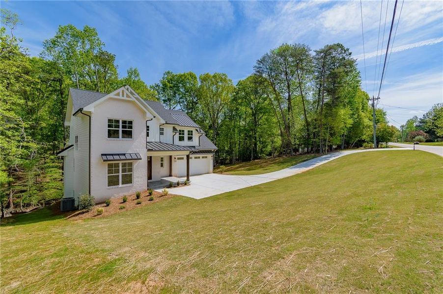 Front exterior of a new home in , Gainesville, GA, highlighting curb appeal (Image 25).