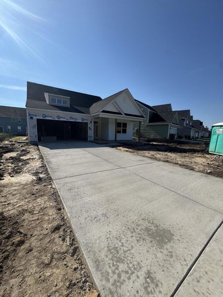 Front exterior of a new home in Oakley Pointe, Moncks Corner, SC, highlighting curb appeal (Image 1).