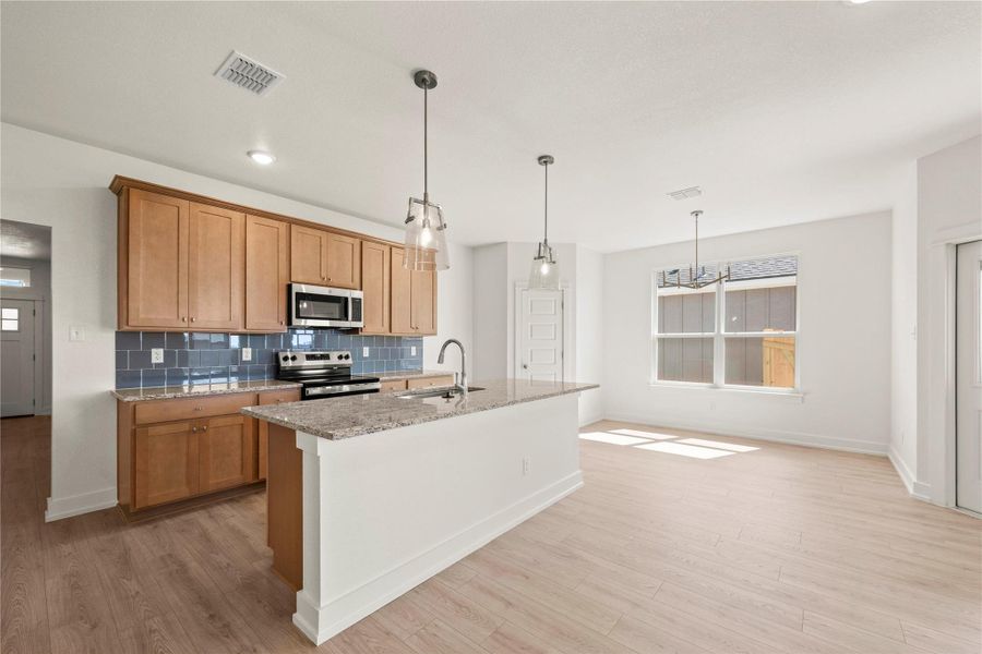 Please Note: These interior photos are not of the actual home but are of a completed one with a simialr floor plan. Finishes, features, and layouts may vary.