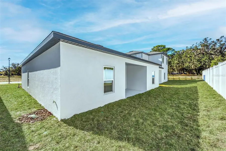 Exterior details and patio area of a home in Tula Parc, Astatula (Image 3). Exterior details and patio area of a home in Tula Parc, Astatula (Image 3).