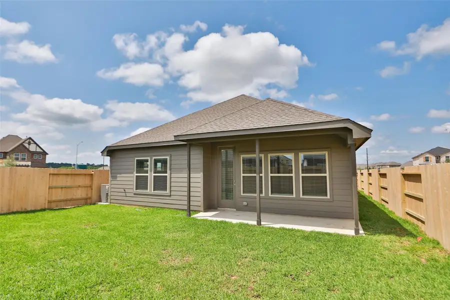 Front exterior of a new home in Cypress Green, Hockley, TX, highlighting curb appeal (Image 1). Front exterior of a new home in Cypress Green, Hockley, TX, highlighting curb appeal (Image 1).