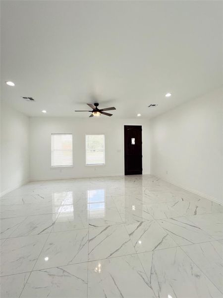 Spare room with visible vents, recessed lighting, marble finish floor, and ceiling fan Spare room with visible vents, recessed lighting, marble finish floor, and ceiling fan