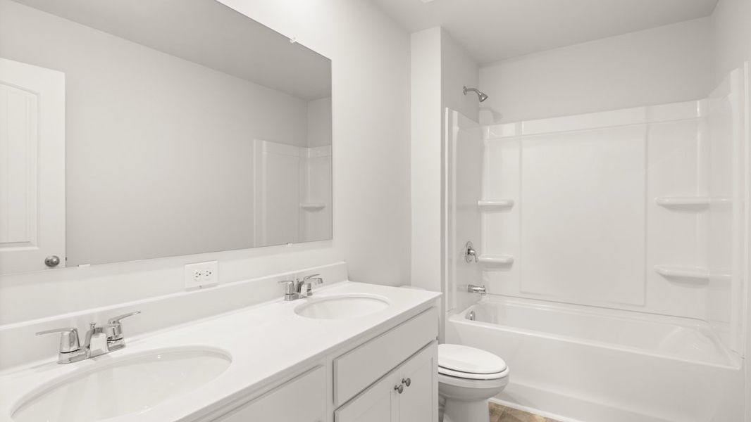 Representative furnished interior of a home built from the Galen by D.R. Horton in Thompson Ridge, Dallas (Image 10).