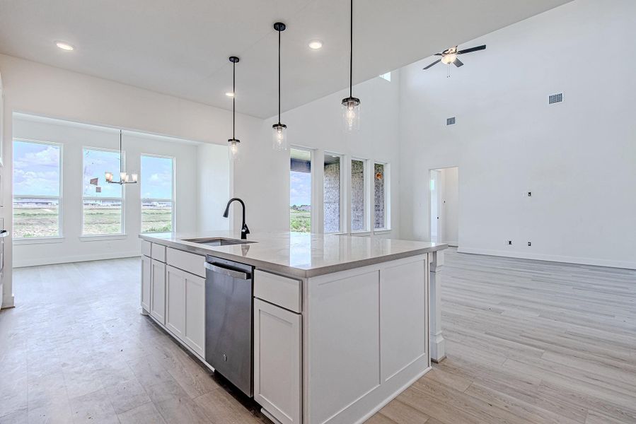 Bright kitchen views with recessed lighting and open sightlines throughout the main floor