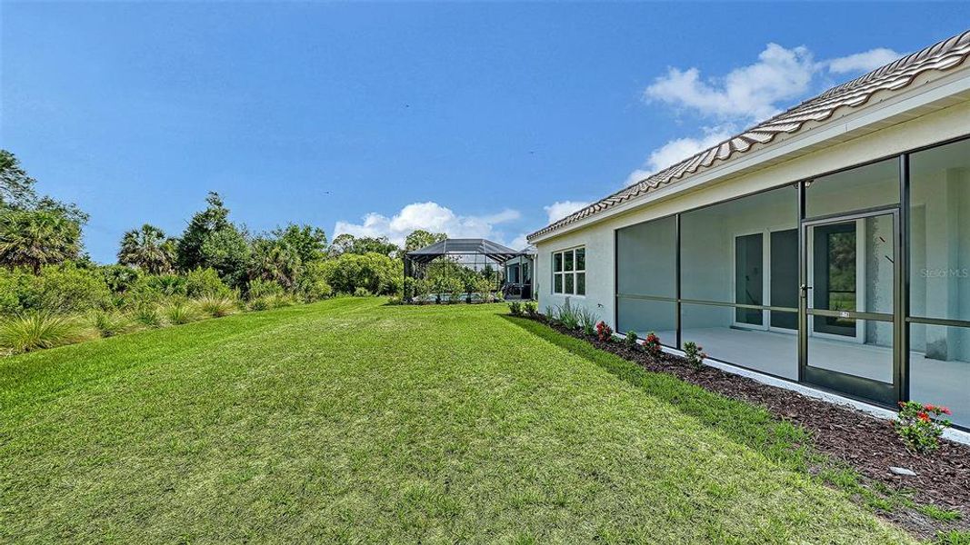 Exterior details and patio area of a home in Grand Park, Sarasota (Image 23).