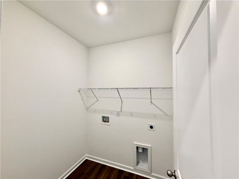 Rich hardwood flooring anchors this practical laun