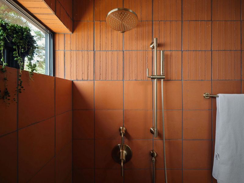 This extruded reversible tile from Clay Imports is a strikingexample of embracing material variation, a design languageseen throughout the space.
