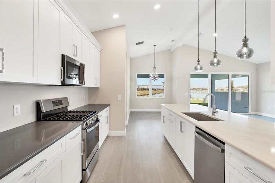 Kitchen with quartz  countertops and chroma granite composite sink