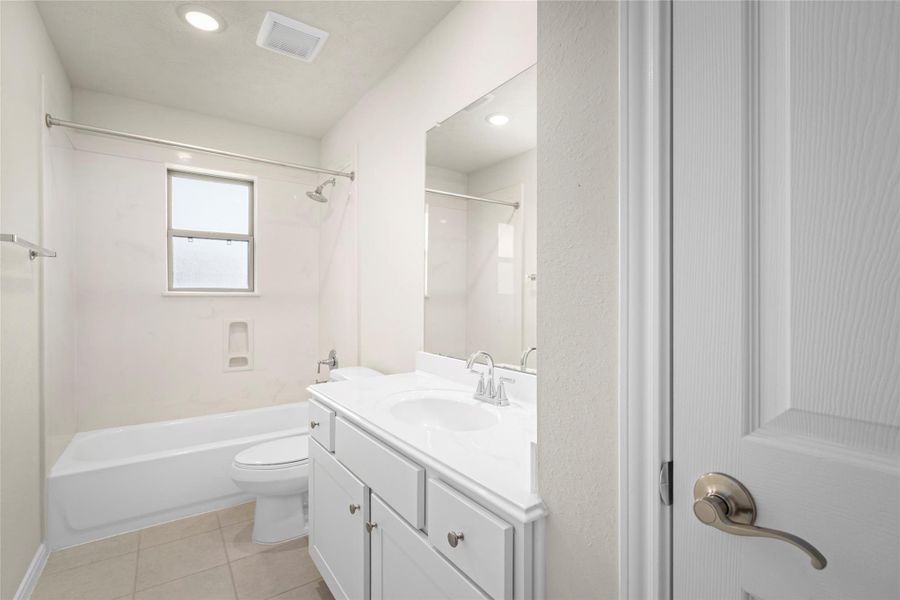 Smartly designed, this full bath features a generous vanity, a full tub/shower combo with built-in niche, and recessed lighting that keeps the space feeling bright and clean. The neutral palette is a designer's dream. Smartly designed, this full bath features a generous vanity, a full tub/shower combo with built-in niche, and recessed lighting that keeps the space feeling bright and clean. The neutral palette is a designer's dream.