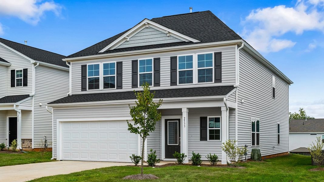 Front exterior of a new home in Hanes Lake, Winston-Salem, NC, highlighting curb appeal (Image 2). Front exterior of a new home in Hanes Lake, Winston-Salem, NC, highlighting curb appeal (Image 2).