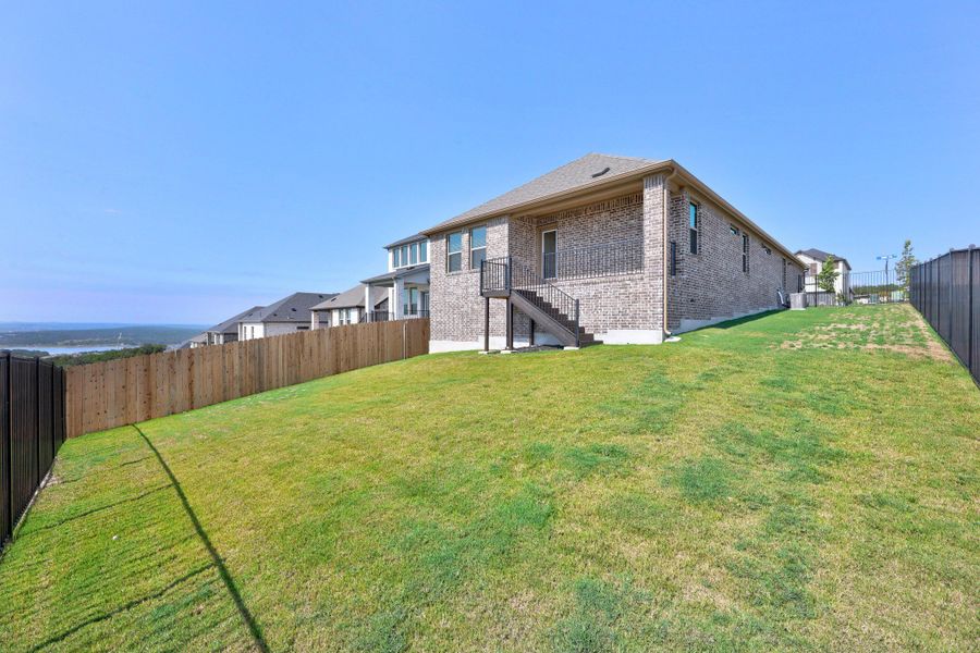 Exterior details and patio area of a home in Lakeside at Tessera, Lago Vista (Image 20).