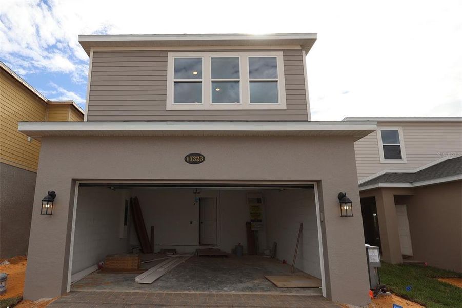 In-progress construction of a new home in Lake Star at Ovation, Winter Garden, FL (Image 22).