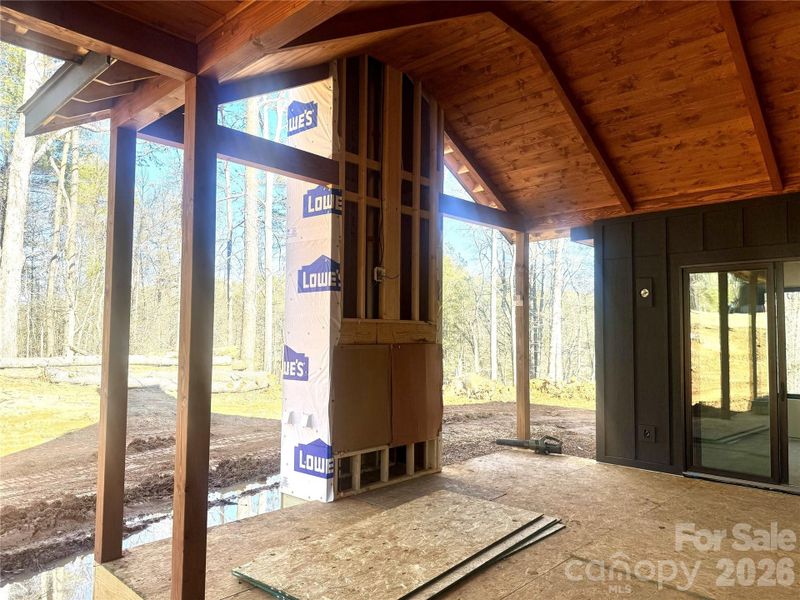 Private outdoor deck featuring vaulted tongue-and-groove ceilings and a wood-burning fireplace. Private outdoor deck featuring vaulted tongue-and-groove ceilings and a wood-burning fireplace.