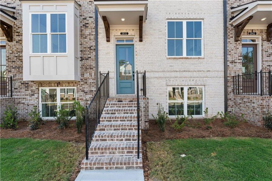 Exterior details and patio area of a home in Evanshire Townhomes, Duluth (Image 26).