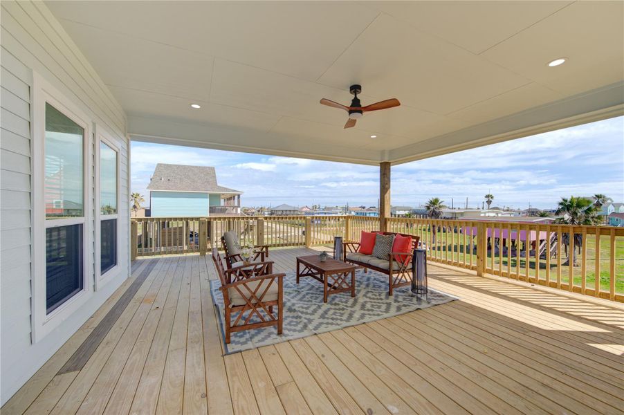 Spacious covered patio perfect for outdoor dining and relaxing coastal living