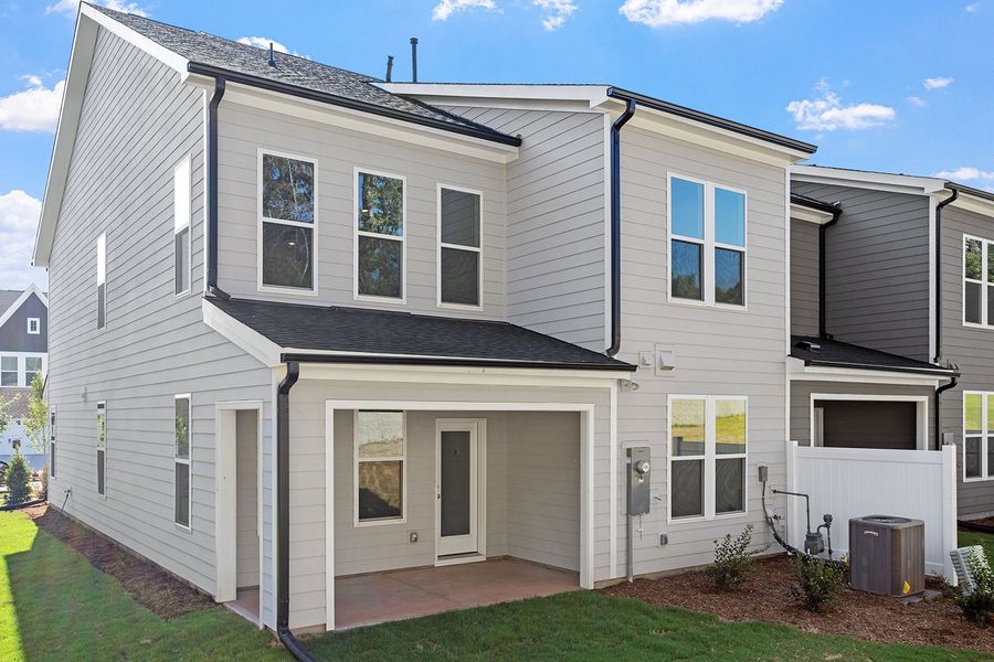 Exterior details and patio area of a home in Ovation at Sweetbrier, Durham (Image 20).