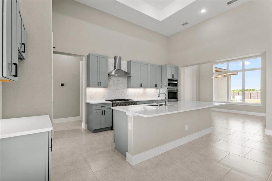 Kitchen also has a breakfast area.